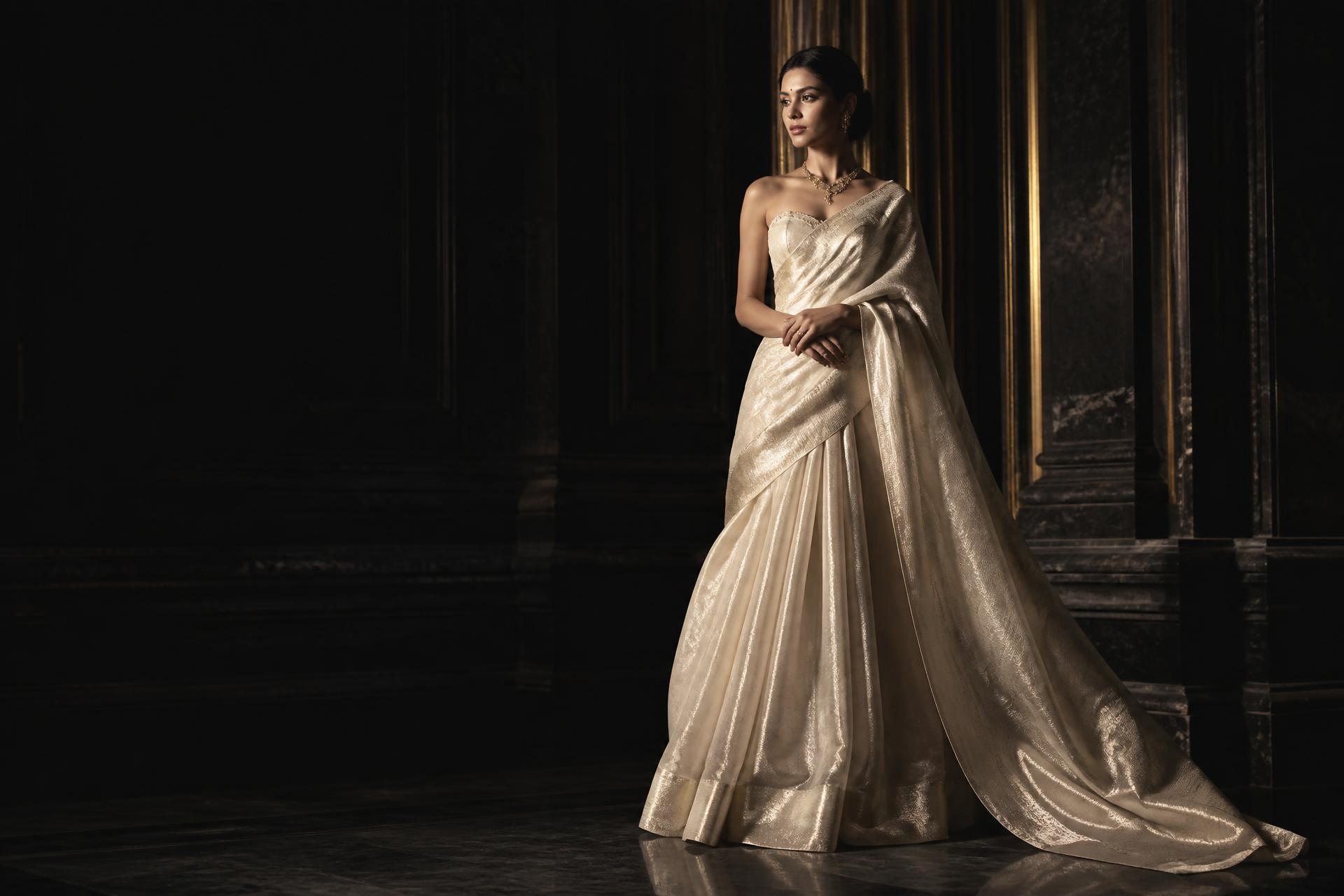Kavya's Fashion new season campaign — ivory tissue silk drape photographed in a dark marble hall